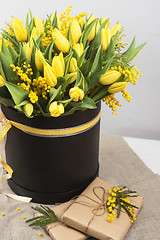 Image showing Bright spring bouquet of tulips and mimosa flowers