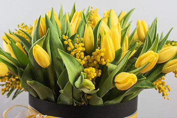 Image showing Bright spring bouquet of tulips and mimosa flowers