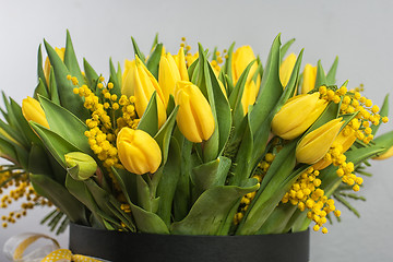 Image showing Bright spring bouquet of tulips and mimosa flowers