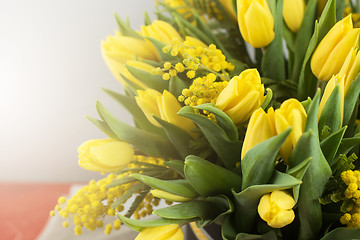 Image showing Bright spring bouquet of tulips and mimosa flowers