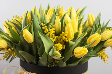 Image showing Bright spring bouquet of tulips and mimosa flowers