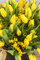 Image showing Bright spring bouquet of tulips and mimosa flowers