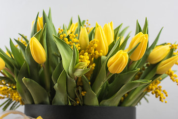 Image showing Bright spring bouquet of tulips and mimosa flowers