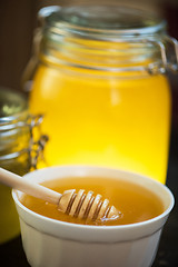 Image showing Honey with wooden spoon