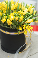 Image showing Bright spring bouquet of tulips and mimosa flowers