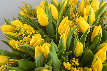 Image showing Bright spring bouquet of tulips and mimosa flowers