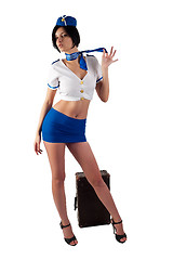 Image showing Young beautiful air hostess with vintage suitcase