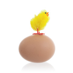 Image showing Easter chicks surrounding a large egg