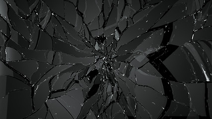 Image showing Pieces of cracked glass on black