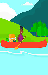 Image showing Woman canoeing on the river.