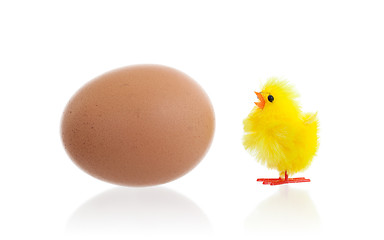 Image showing Easter chicks surrounding a large egg