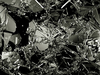 Image showing Pieces of destructed Shattered glass on black