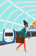 Image showing Woman going out of train.