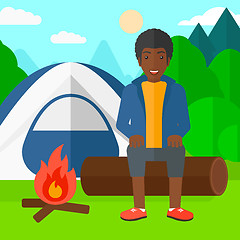 Image showing Man sitting at camp.