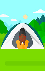 Image showing Woman lying in tent.