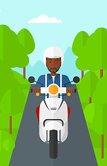 Image showing Man riding scooter.