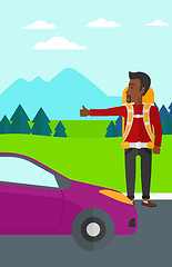 Image showing Young man hitchhiking.