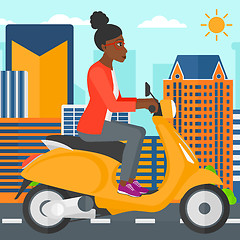 Image showing Woman riding scooter.