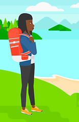 Image showing Woman with backpack hiking.