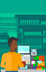 Image showing Cashier at supermarket checkout.