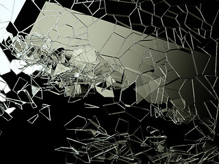 Image showing Pieces of splitted or cracked glass on black