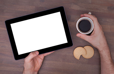 Image showing Tablet touch computer gadget on wooden table