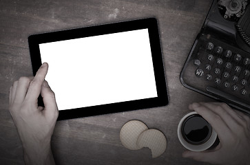 Image showing Tablet touch computer gadget on wooden table