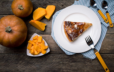 Image showing Rustic style Pumpkin slices and piece of pie  