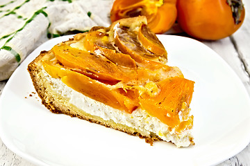 Image showing Pie with curd and persimmons in plate on board