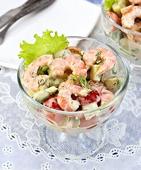 Image showing Salad with shrimp and tomatoes in glass on table