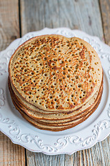 Image showing Pancakes from wholemeal flour on a plate. View from above.