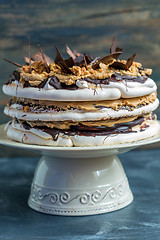 Image showing Coffee cake with meringue, hazelnut and chocolate.
