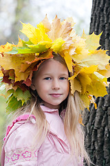 Image showing young girl in maple wreath