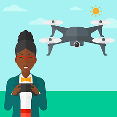 Image showing Woman flying drone.