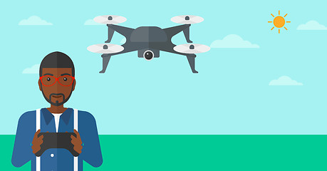 Image showing Man flying drone.