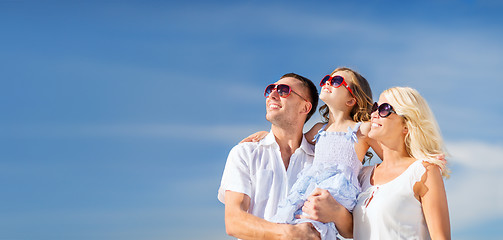 Image showing happy family with blue sky