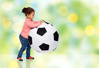 Image showing happy mulatto little baby girl playing with ball