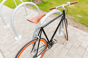 Image showing close up of fixed gear bicycle at street parking