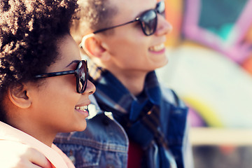 Image showing happy teenage friends in shades outdoors