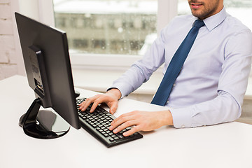 Image showing close up of businessman hands typing on keyboard