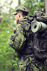 Image showing young soldier with backpack in forest