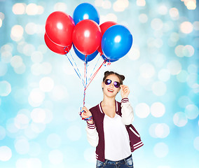 Image showing happy teenage girl with helium balloons