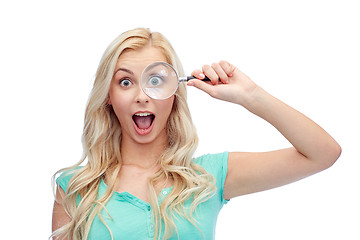 Image showing happy young woman with magnifying glass