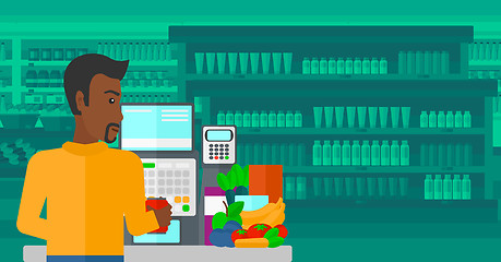 Image showing Cashier at supermarket checkout.