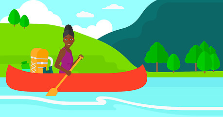 Image showing Woman canoeing on the river.