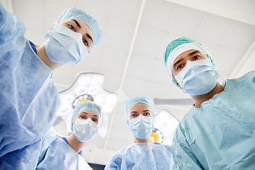 Image showing group of surgeons in operating room at hospital