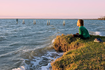 Image showing boy looking over lake