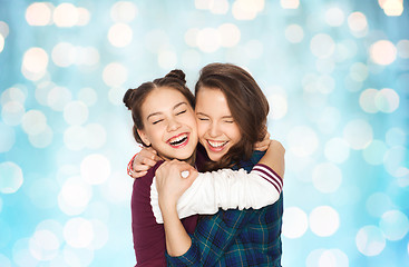 Image showing happy smiling pretty teenage girls hugging