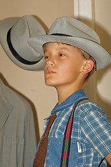 Image showing boy trying hat