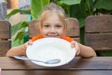 Image showing Five-year girl showing empty plate to eat